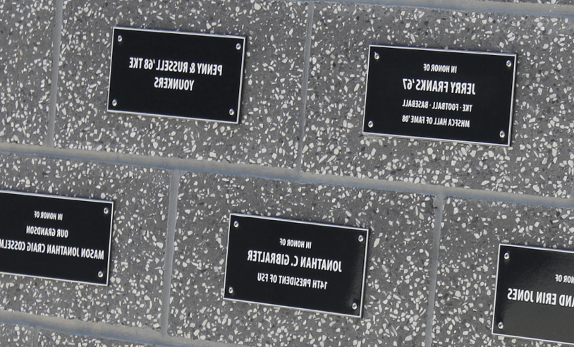Name plaques on the stadium wall